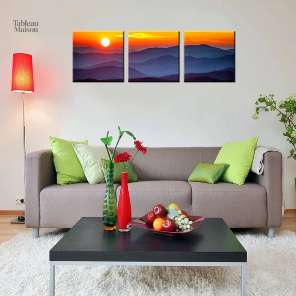 Tableau coucher de soleil sur des montagnes majestueuses