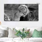 Tableau noir et blanc de lion et lionne en harmonie