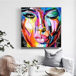 Œuvre d'art abstraite sur toile avec motifs de visage